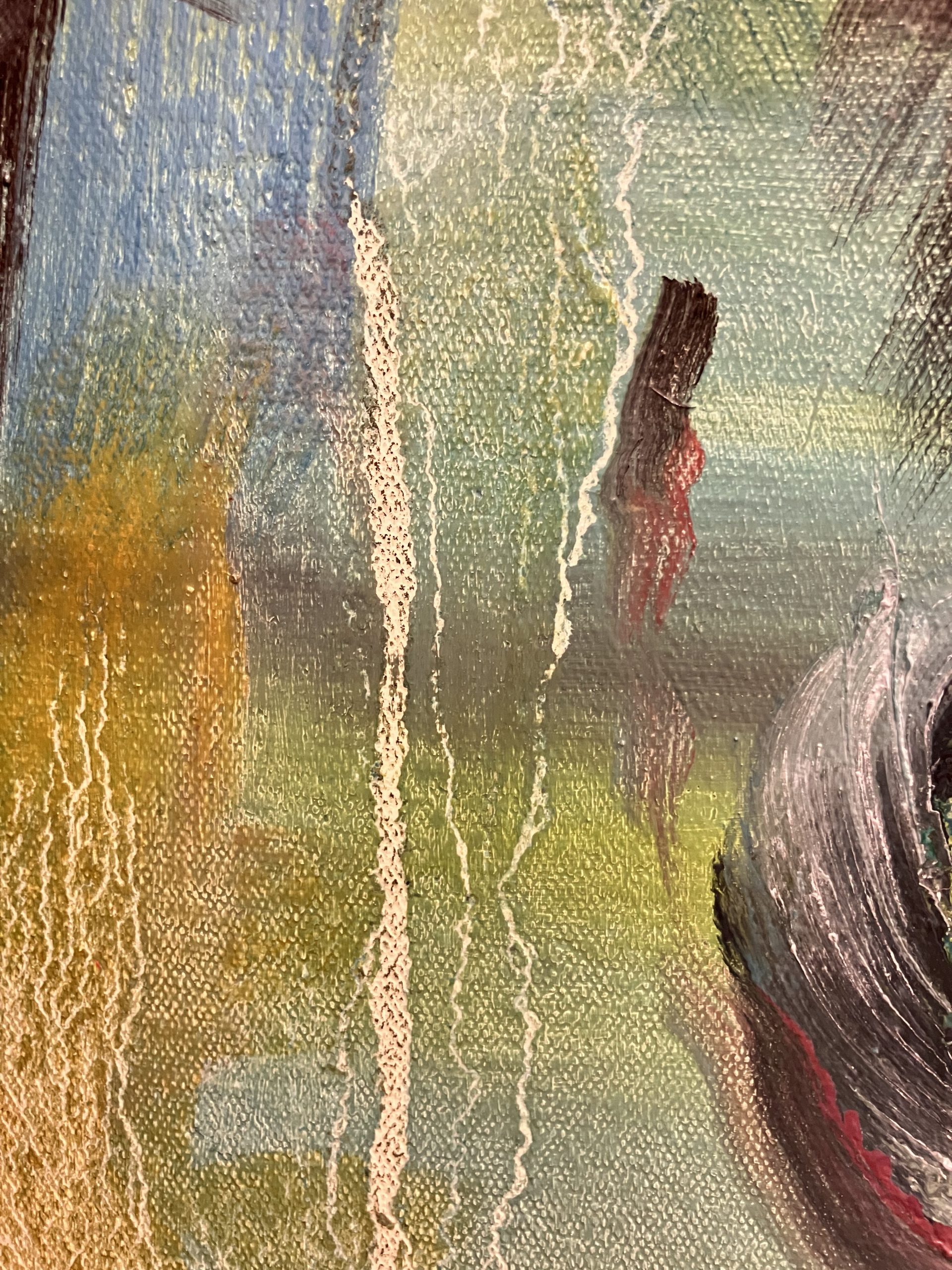 Close-up of the linseed oil drips on the background beside the grey bundle. Primary colors are yellow, green, and magenta.